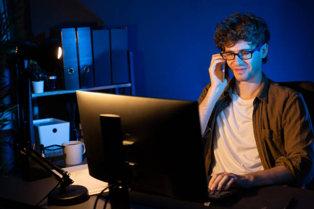 istock Young businessman calling on phone to customer or coworker. Gusher. 2030160882