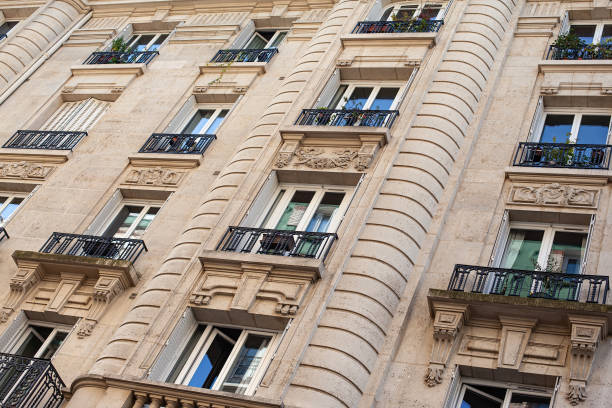 Elegant facade of a stone building in a Parisian avenue
