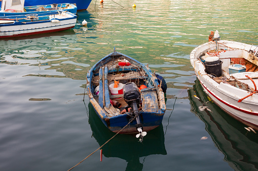 A characteristic pier with the fishers boats in a sunny day in Sicily