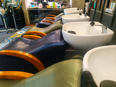 Close-up shot row of shampoo sink at hair salon
