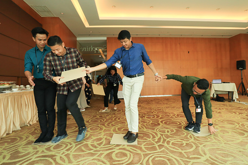 Office team building game or ice breaker at a business conference