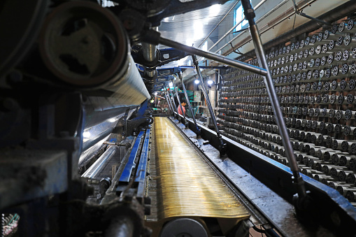 The workers are working hard on the weaving line in a processing plant, North China