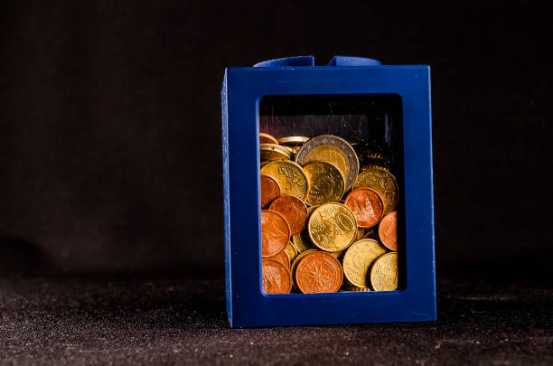 Euro banknotes and coins symbolizing savings with a piggy bank