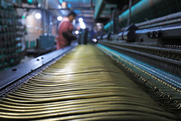 The workers are working hard on the weaving line in a processing plant, North China