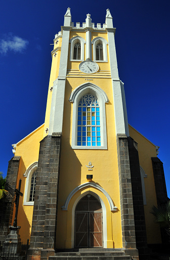 Mahébourg, Grand Port District, Mauritius: bell and clock tower of the Catholic Church Notre Dame Des Anges, this straw-colored temple was originally built in 1849 and renovated in 1938 and 1949.