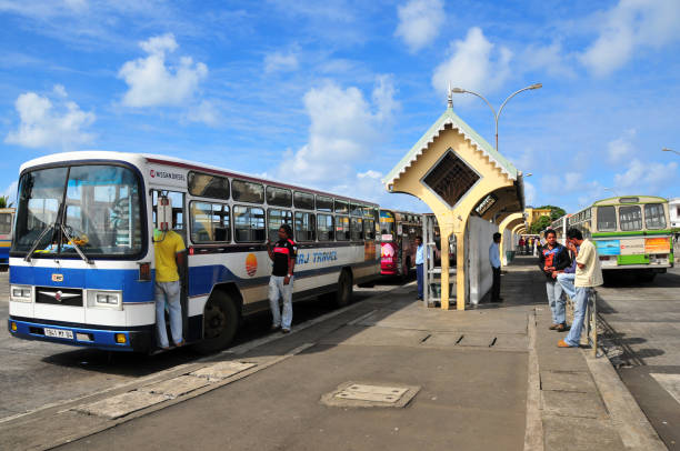 Mahébourg, Grand Port District, Mauritius, Mascarene Islands: people and vehicles at Maheburg bus terminal on Rue des Hollandais, downtown, by the waterfront.