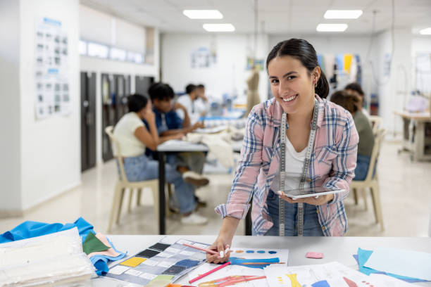 istock Fashion design student drawing a sketch in the classroom 2030272613