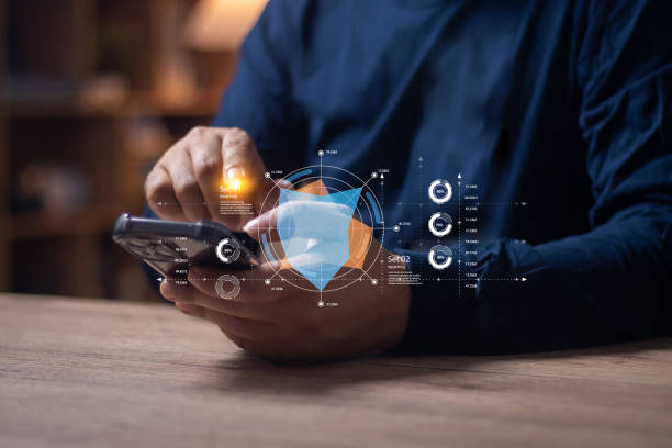 istock Men's hands on the table use mobile phones, technology, communications, the Internet. 2030279697