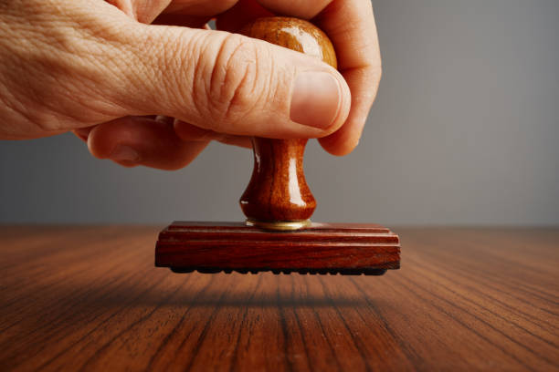 Old wooden office hand stamp on desk