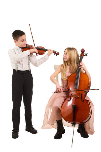 istock Boy and girl playing violin and cello 2030286451