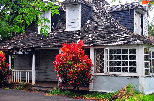 Mahébourg, Grand Port District, Mauritius, Mascarene Islands: police station in an old Creole style building, with shingled roof and dormer windows - Southern division police, sub divisional office.
