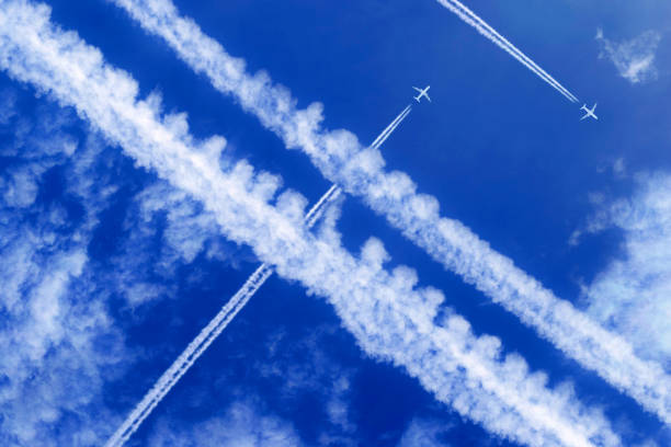 istock vapor trails and passenger jets high in the sky 2030313122