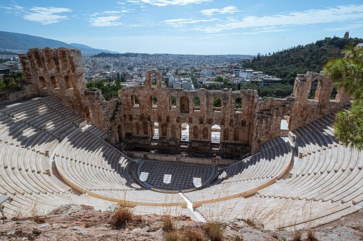 A breathtaking panoramic view from a hilltop of a majestic Roman amphitheater with historical significance.