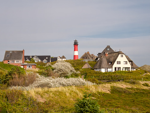 Lighthouse and holiday homes in dunes of Hornum on Sylt island, North Frisia, Schleswig-Holstein, Germany