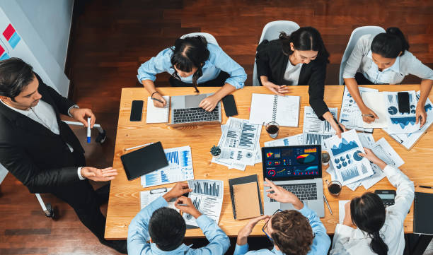 istock Wide top view diverse analyst team analyzing financial data. Habiliment 2030332440