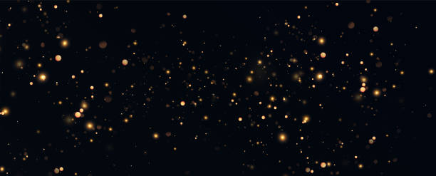 istock Golden sequins glow with many lights. Glittering dust. Luxurious background of golden particles. 2030337346