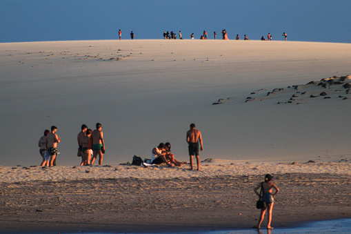 people at the dune, at the sunset