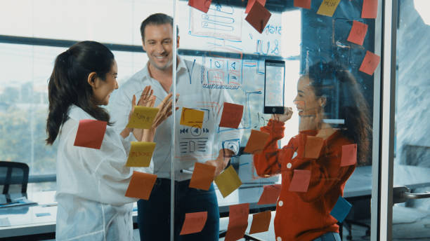 istock Happy business team celebrate successful project at glass wall. Manipulator. 2030351372