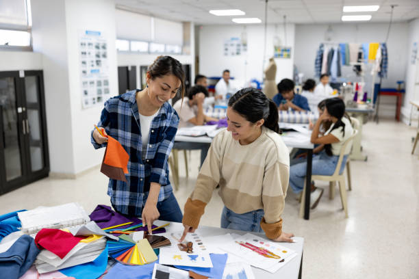 istock Teacher teaching student about the color theory in a textile class 2030353215