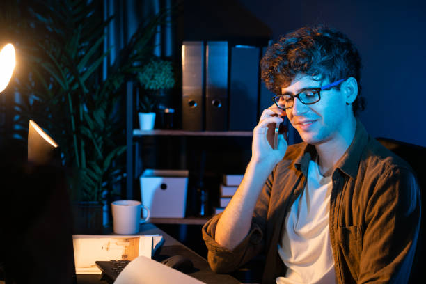 istock Young businessman calling on phone to customer or coworker. Gusher. 2030360180