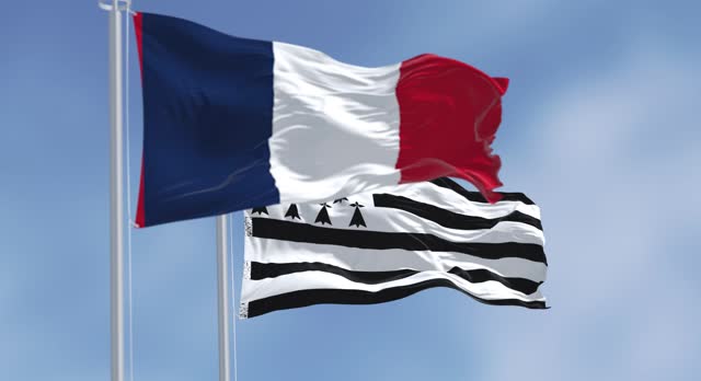 Brittany flag waving with french national flag on a clear day