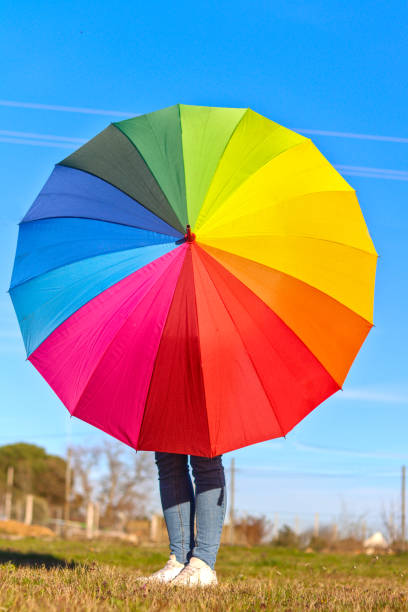 istock Unrecognizable person with colorful umbrella 2030391800