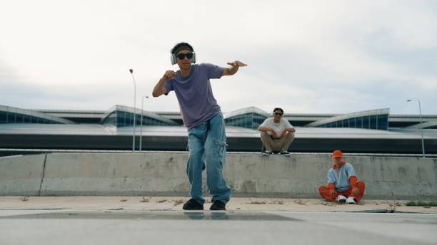 istock Group of dancer perform street dance with friends looking at him. Sprightly. 2030392343