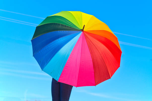 istock Unrecognizable person with colorful umbrella 2030394020