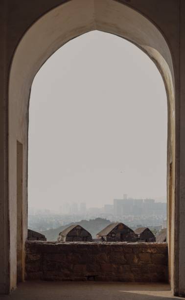 istock View through archway onto hazy city, India 2030398834