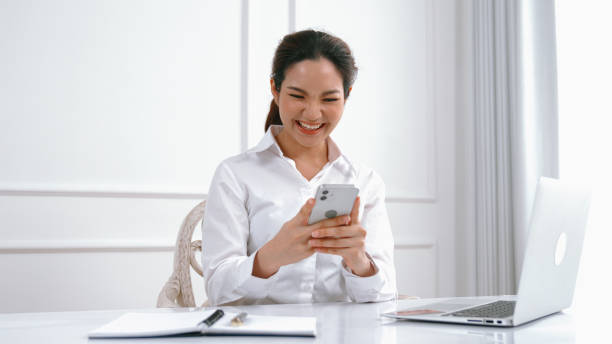 istock Young woman using smartphone browsing for online shopping E commerce by online payment gateway at vivancy home. Modern and convenience online purchasing make secure and convenient purchases. 2030400508