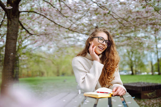 Beautiful woman with bouquet of tulips