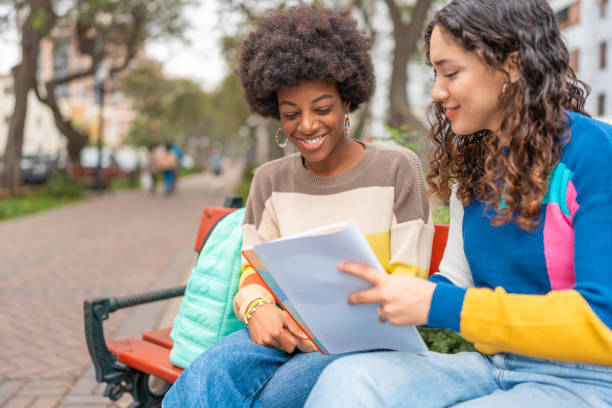 istock University students, studying outdoors 2030417377