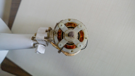 Small white fan with 4-blade propeller repair tool repair