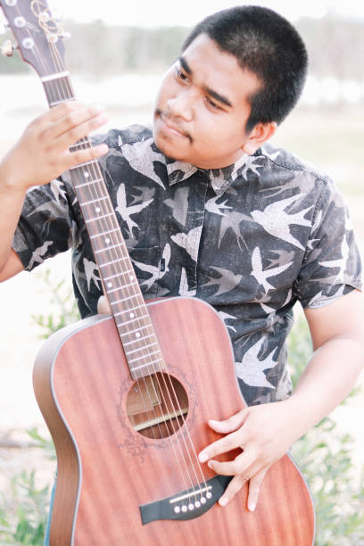istock male southeast asian musician 2030430577