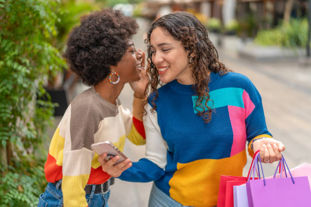 istock Women shopping, telling a secret 2030431700