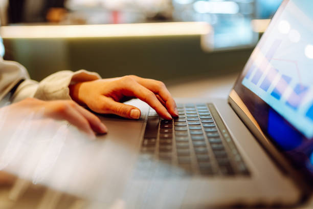 istock Close-up of hands working on a laptop keyboard. 2030431737