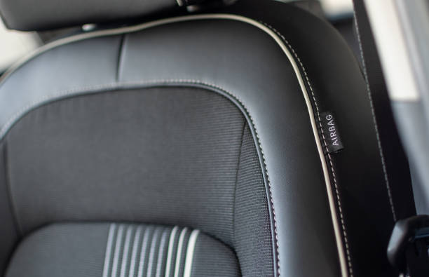 istock Passenger car seat with airbag on blurred background 2030433636