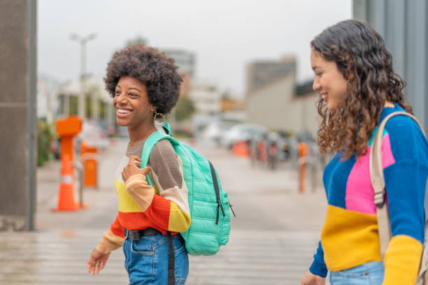 istock Happy friends walking together to college 2030441004