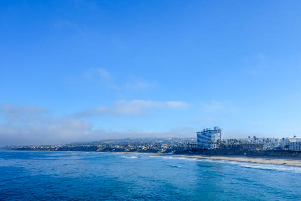 Early morning at Pacific Beach surrounded by seaside hotels and recreational areas as seen from Crystall Pier in San Diego, Southern California