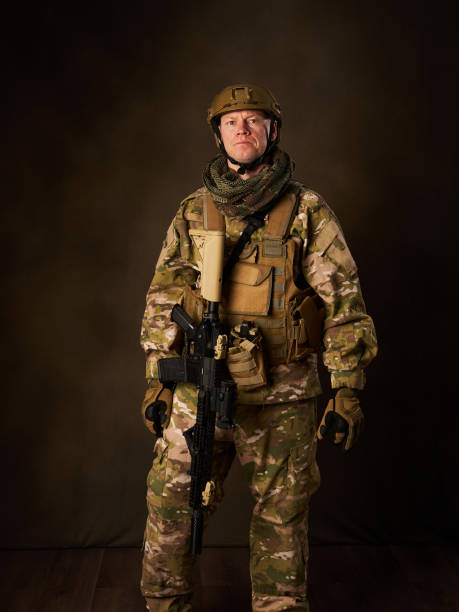istock a young military soldier with automatic airsoft rifle with telescopic vision 2030504478