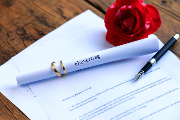 istock Marriage contract with wedding rings 2030514600
