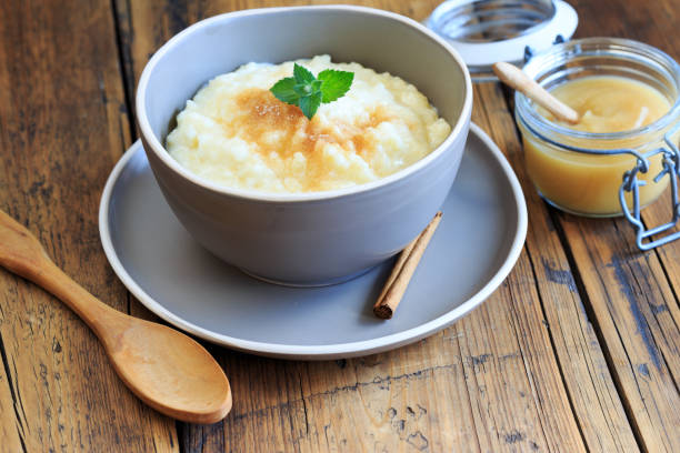 istock Rice pudding with cinnamon and apple sauce 2030517750
