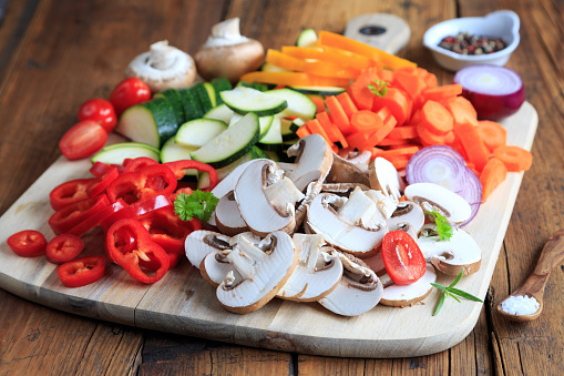 colourful mix of vegetables on wooden board