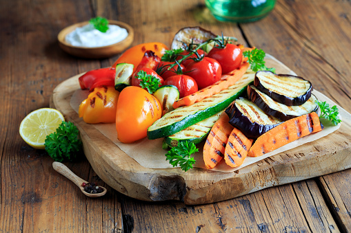 Grilled vegetables on a wooden board