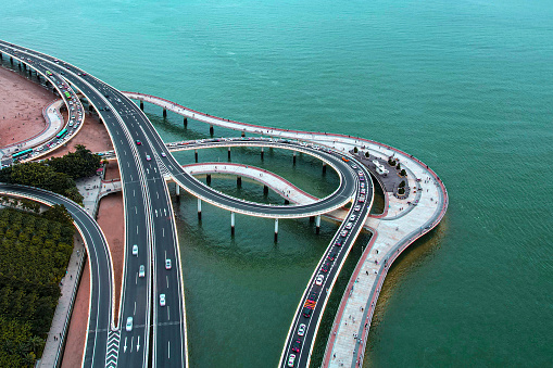 The picture was taken in Xiamen City, Fujian Province, China. The curve of the cross-sea bridge is designed to be very beautiful, like a music score lying on the sea.
