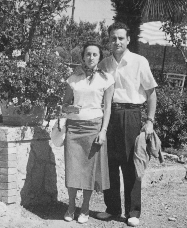 Young couple standing in a street. 1952.