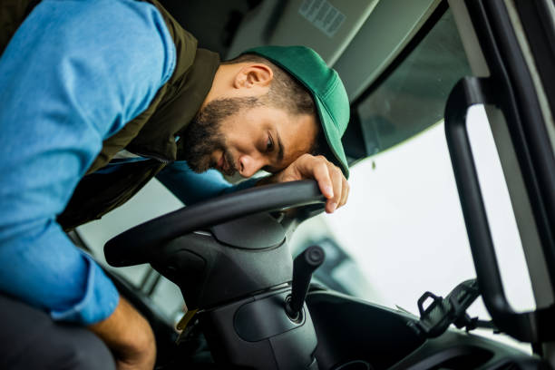 istock Truck driver feeling tired during the ride. 2030549621