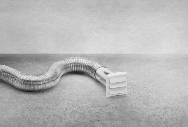istock Dryer venting parts pipe and vent cover on a concrete background 2030557583