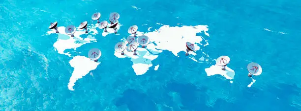 Satellites float over a sea-blue map, symbolizing worldwide connectivity