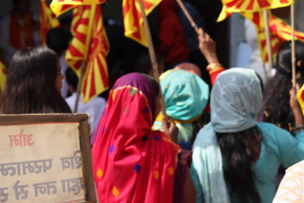 A Group or Crowd of Brahma Kumaris community leading a parade for peace message and holding flags of brahma kumaris or Om shanti, timeless